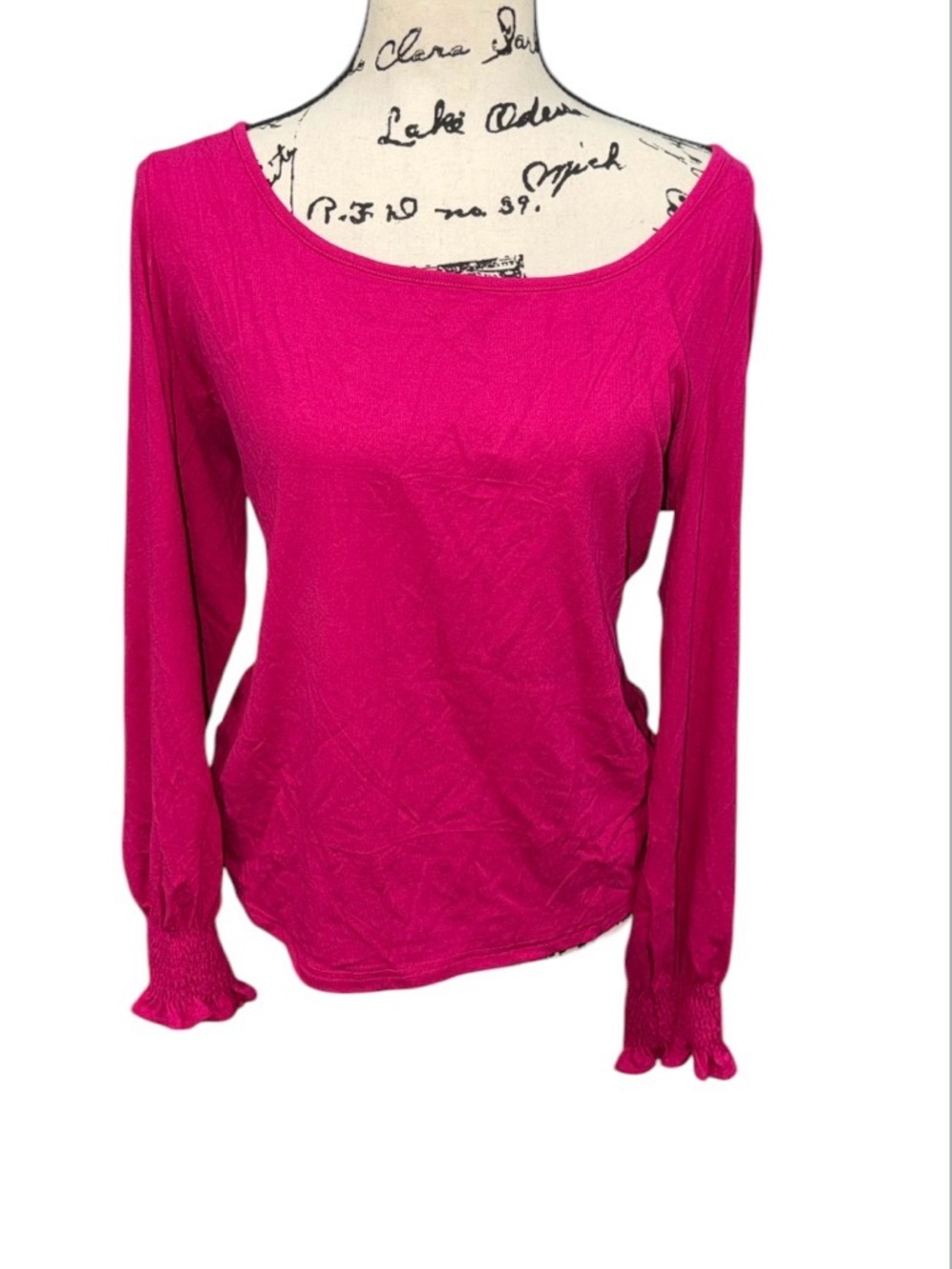 Pink fuchsia long-sleeve blouse with a boat neck and smocked cuffs